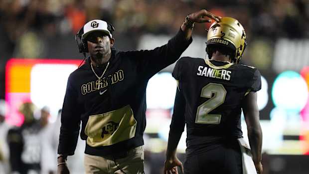 Sep 16, 2023; Boulder, Colorado, USA; Colorado Buffaloes quarterback Shedeur Sanders (2) and head coach Deion Sanders following a two point conversion in the fourth quarter against the Colorado State Rams at Folsom Field